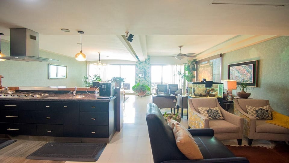 Spacious open-concept living and kitchen area with natural light