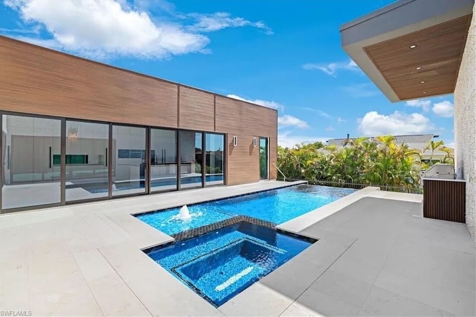 Pool side - sliders all around and pool bath