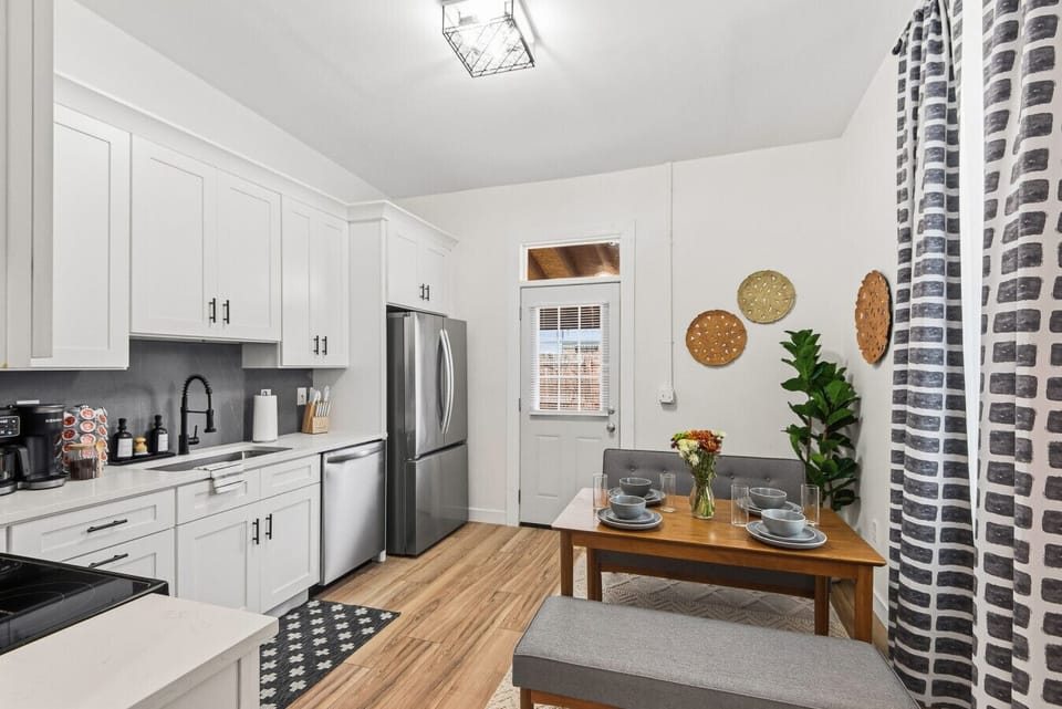 Fully Equipped Kitchen: Prepare meals with ease thanks to all new stainless steel appliances, white shaker cabinets, and comfortable dining for four—make yourself at home and enjoy a meal!