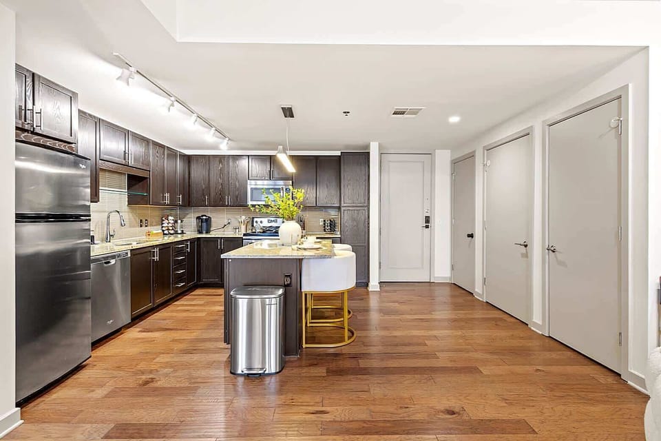 Spacious kitchen with stainless steel appliances, ample counter space, and modern cabinetry. Fully equipped for cooking and enjoying meals at home.