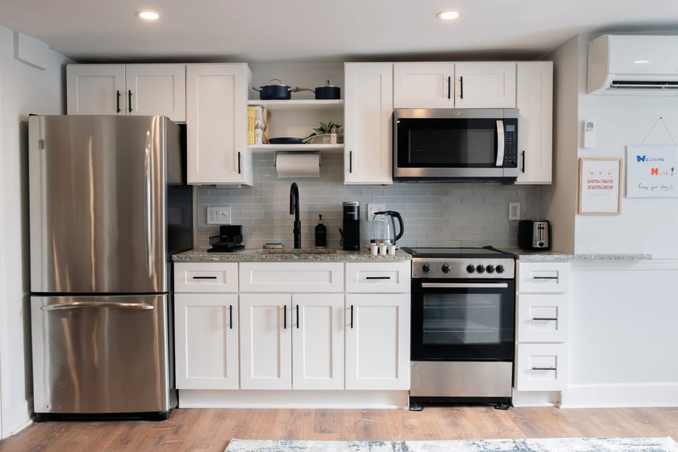Large fridge/freezer, microwave, oven, toaster, Keurig, kettle, utensils, pots
