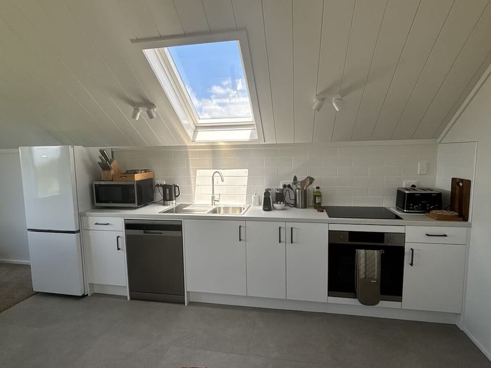 Upstairs in the cottage -includes a full kitchen, dining and casual seating area