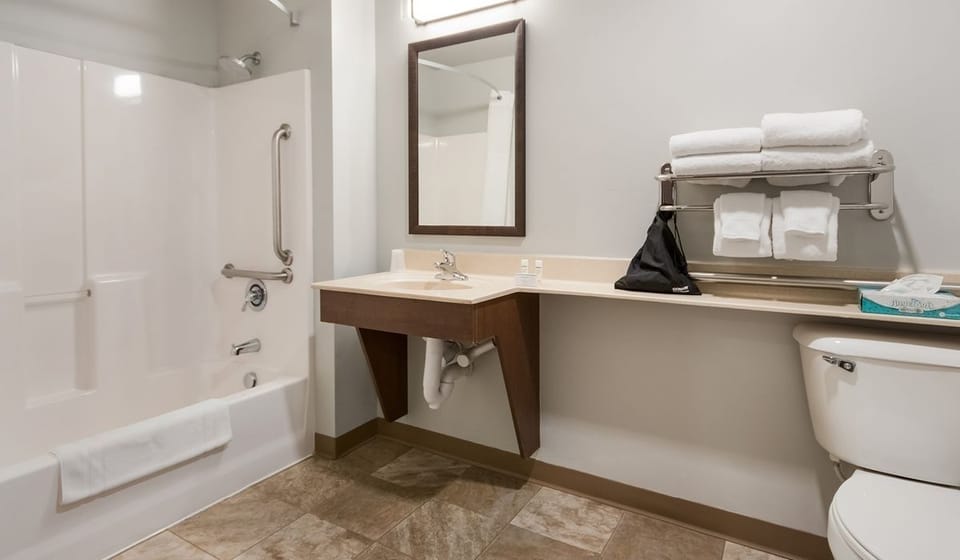 Unwind after a long day with fresh towels ready.
