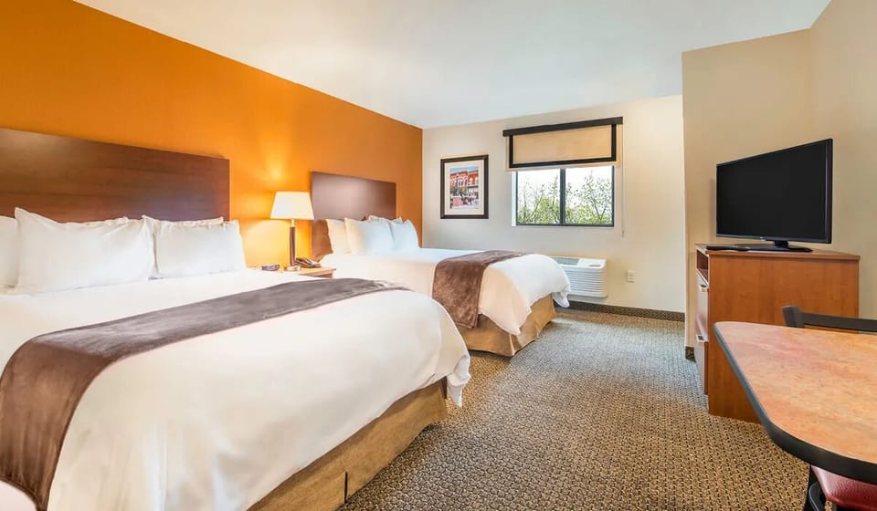 Unwind in a bright, spacious room with two plush beds.