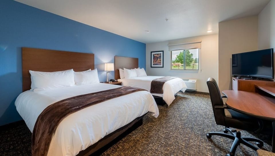 Unwind in a spacious double-queen room with sunny views.