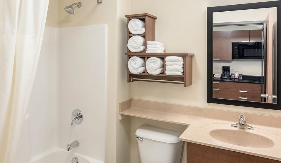 Refresh after adventures in a spotless bath with plush towels.