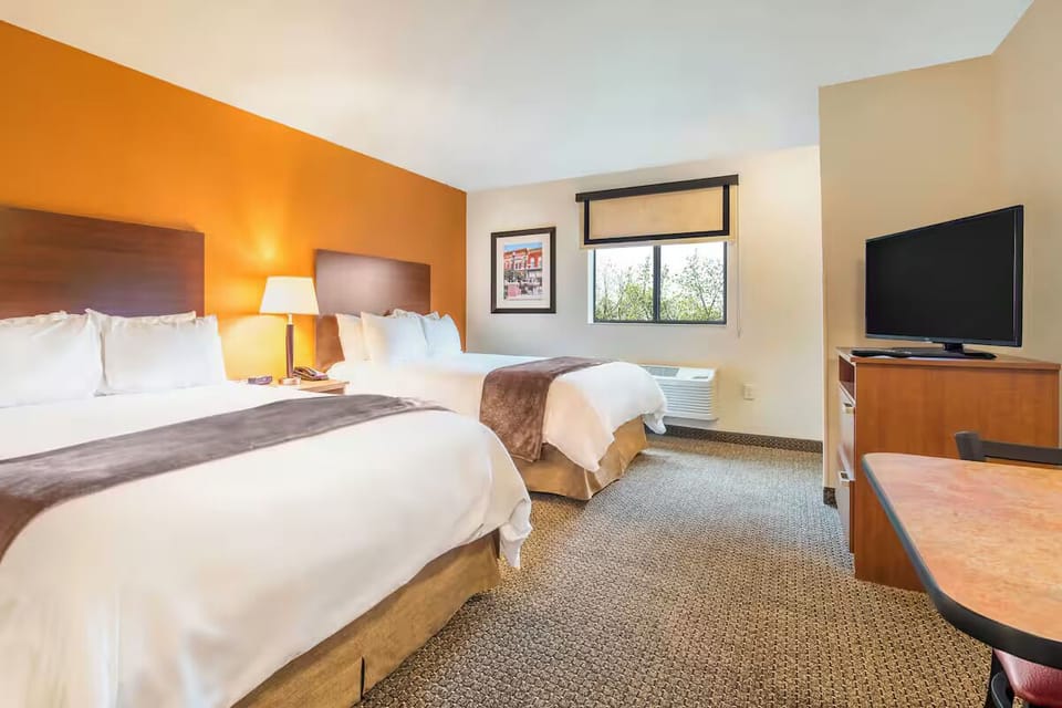 Stretch out on double beds in a bright, inviting room.