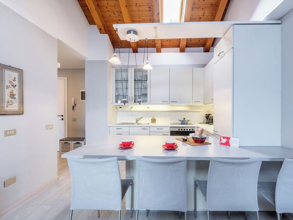 Furniture, Kitchen, Interior Design, Flooring, Countertop, Ceiling, Wood, Chair, Floor, Light Fixture