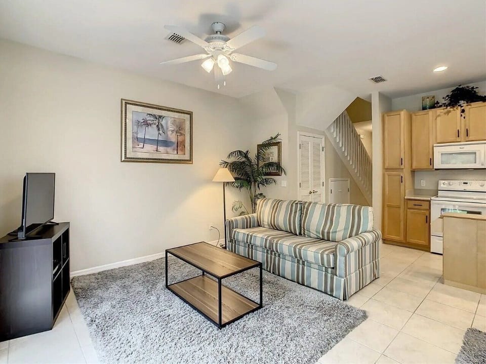 Kick back and relax in our spacious living room. With comfortable seating and a smart TV, it's the perfect spot for family downtime after exploring Kissimmee.
