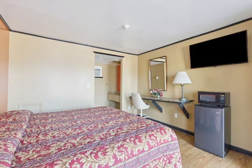 Recharge in comfort with in-room fridge, microwave, and wall-mounted TV.