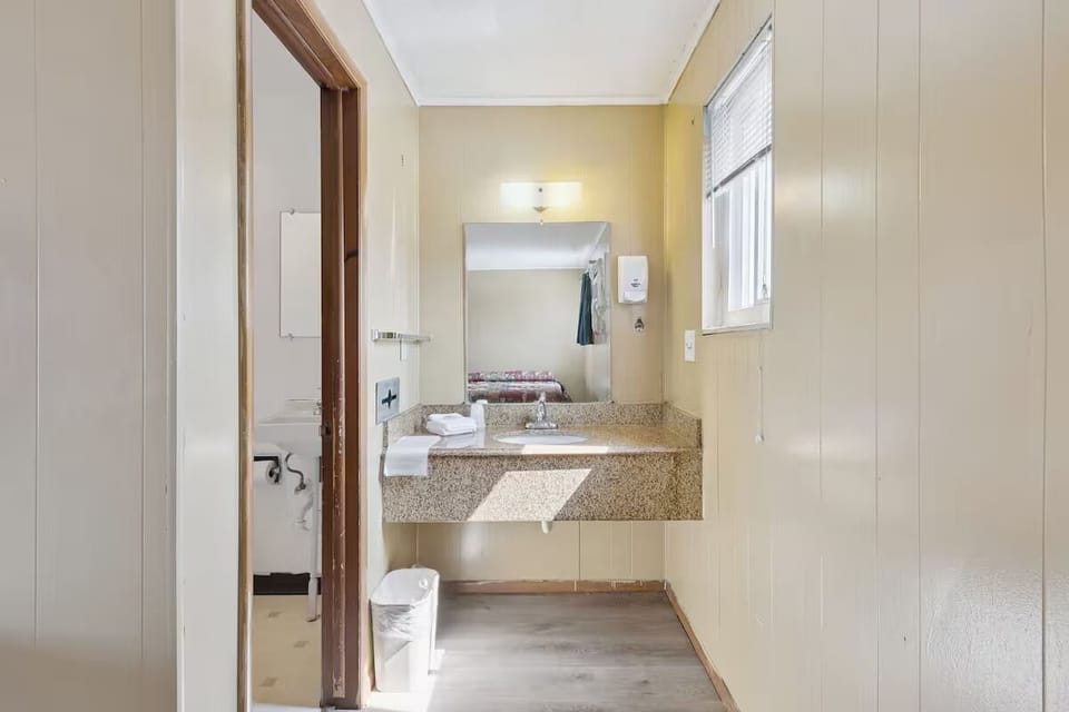 Get ready with sunny counter space and a wide mirror.
