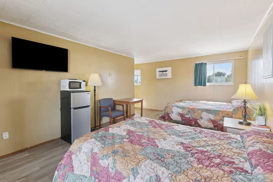 Enjoy easy stays with dining table, fridge, microwave, and big TV.