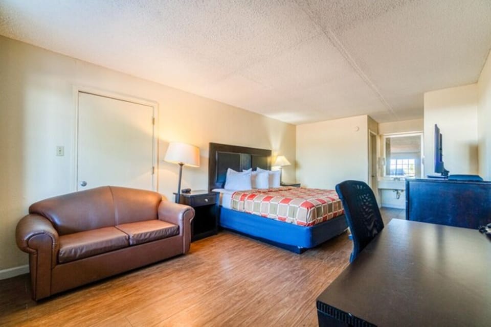 Stretch out and relax with sofa seating beside the bed.