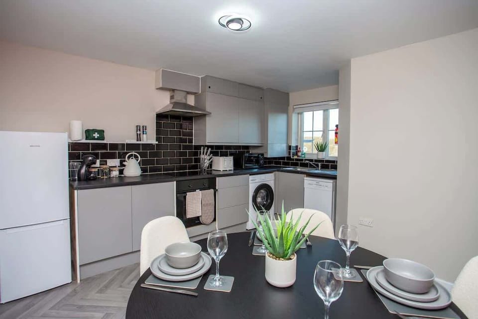 Fully equipped kitchen with sleek finishes and everything you need to cook at home