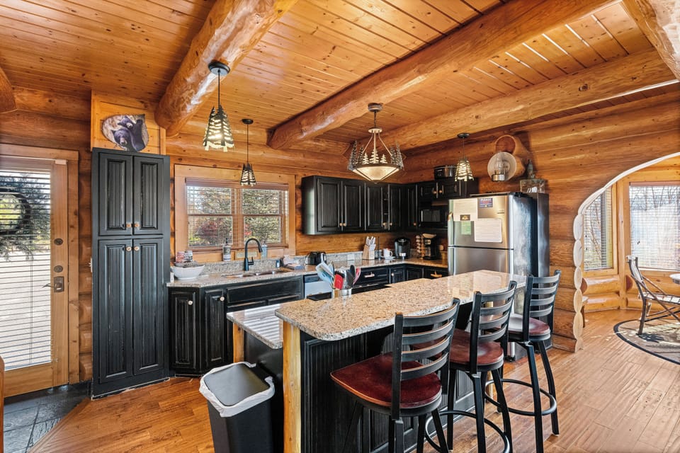 Kitchen with rustic cabinetry & stainless appliances
