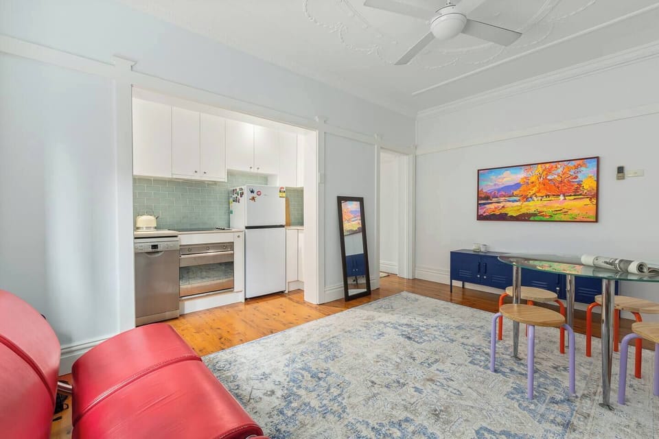 The open-plan layout shows how the living, dining and kitchen areas connect seamlessly, creating a cosy social hub for your group.
