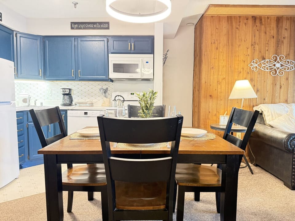 Enjoy meals in our kitchen with a four-seat dining setup.
