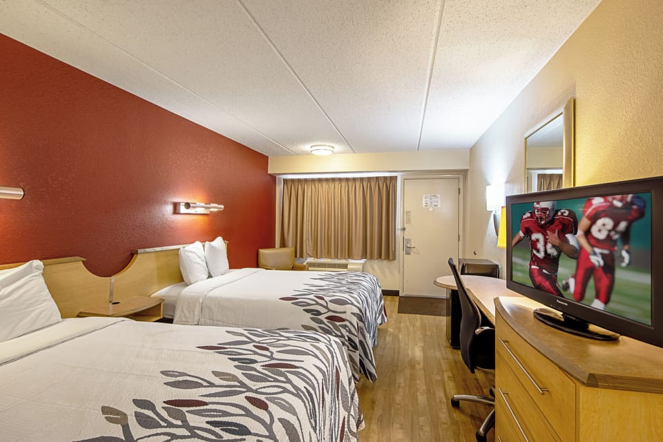 Stretch out with two comfy beds and cozy lighting.
