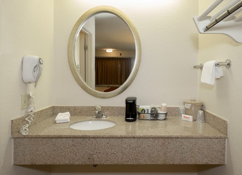 Get ready comfortably with ample counter space and mirror.