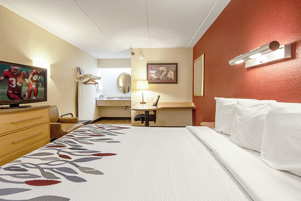 Unwind on crisp linens in a bright, spacious room.