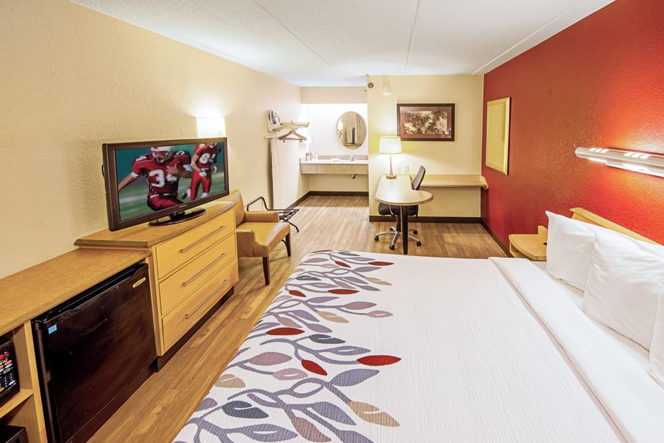 Unwind on the plush king bed after a busy day.