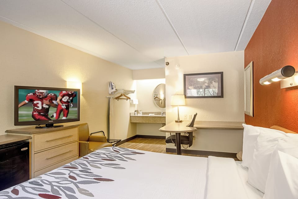 Catch up on work at the desk, then sink into bed.