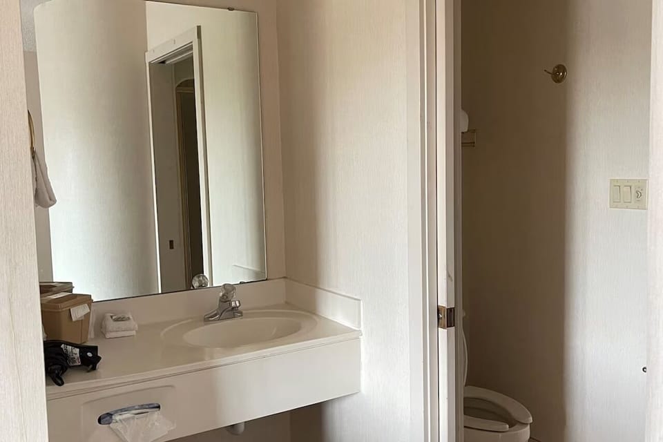 Refresh easily with a clean vanity and bright mirror.