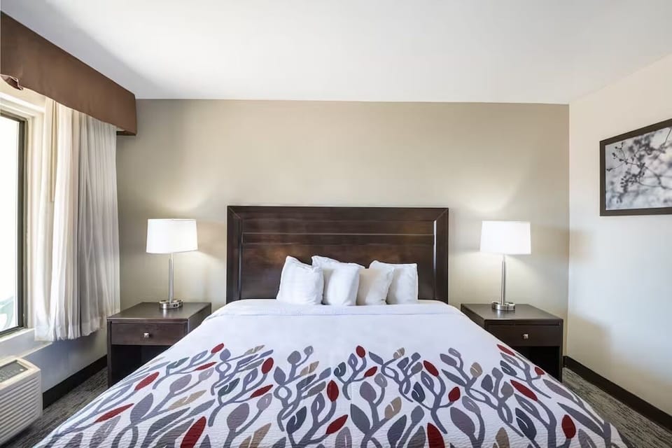Sink into crisp linens for a restful night’s sleep.