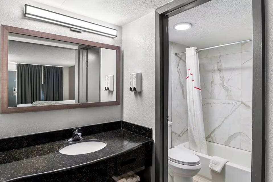 Start your morning with a spacious counter and bright mirror lighting.