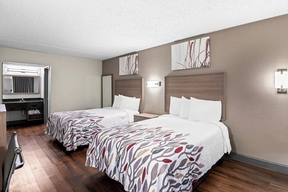 Enjoy extra space to unpack and relax between two plush beds.