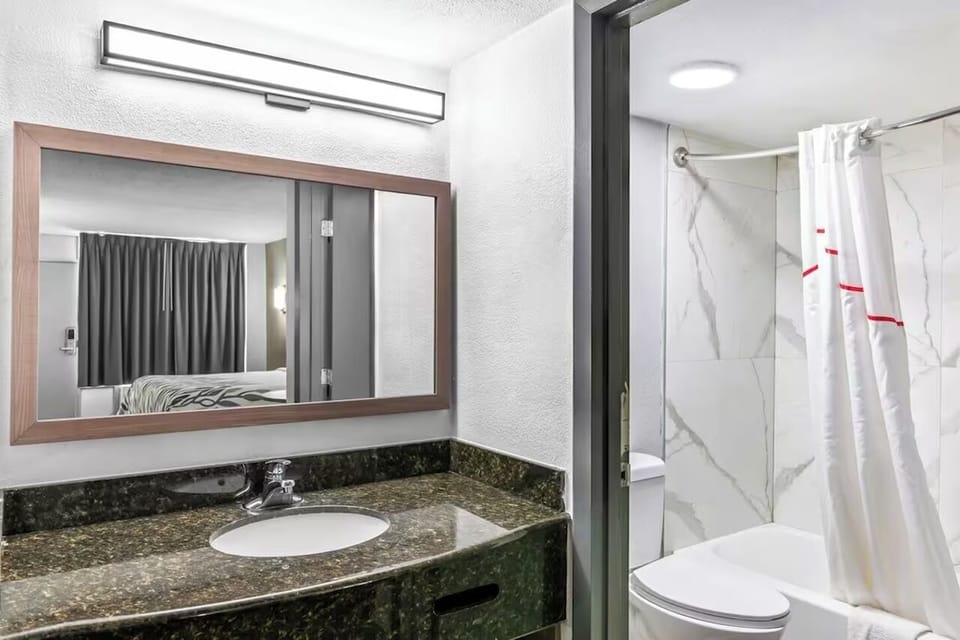 Refresh at the bright vanity, then enjoy a steamy shower.