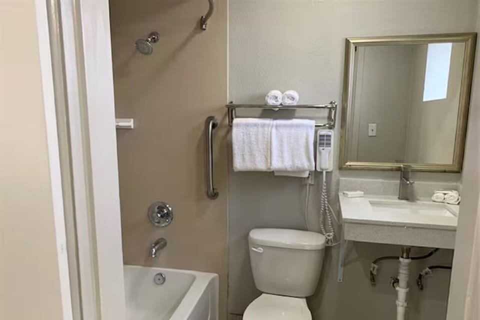 Rinse off and reset in a bright, practical bath setup.