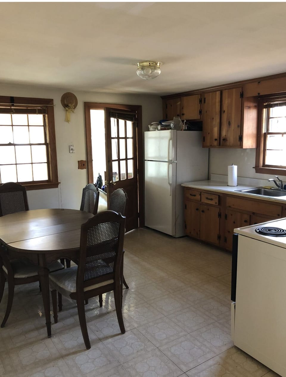 Open and airy eat-in kitchen with new ceiling fan.