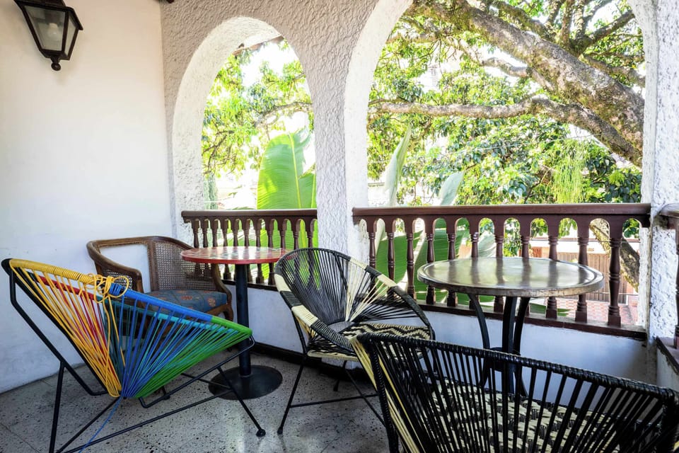 Covered balcony with garden views