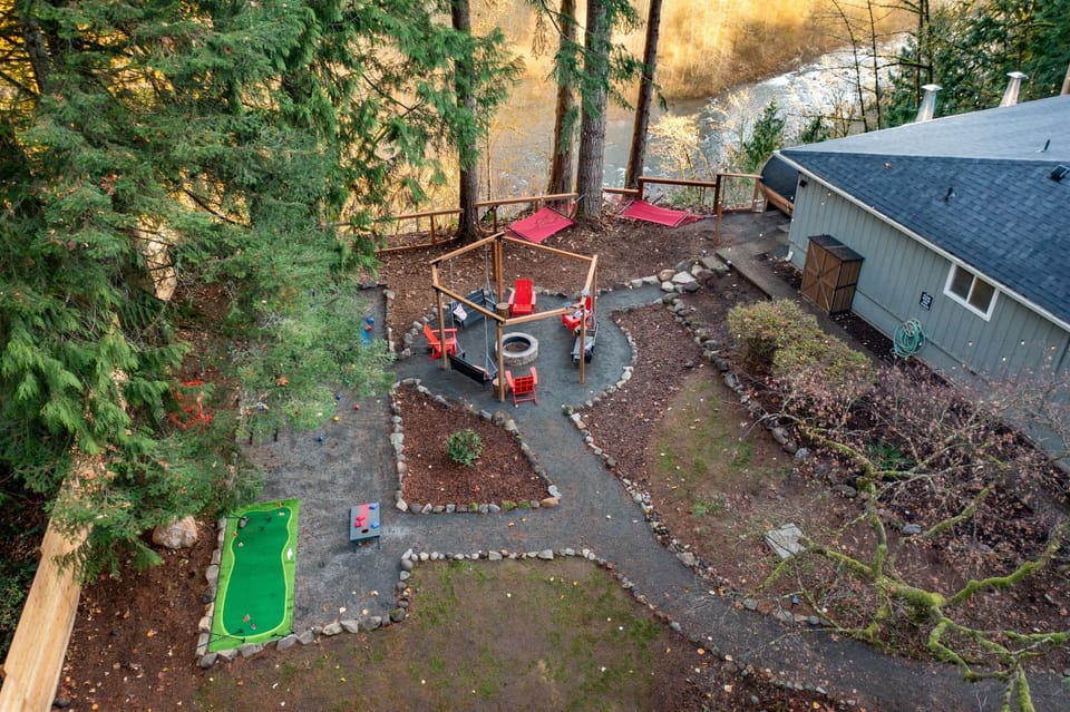 Enjoy endless fun with hammocks, a putting green, yard games, and a cozy fire pit—an inviting outdoor space designed for families, friends, and unforgettable nights under the pines.