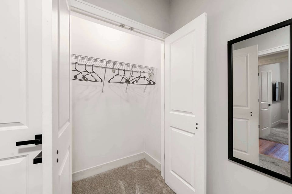 Open closet w/ hangers & shelves ready for your stay,