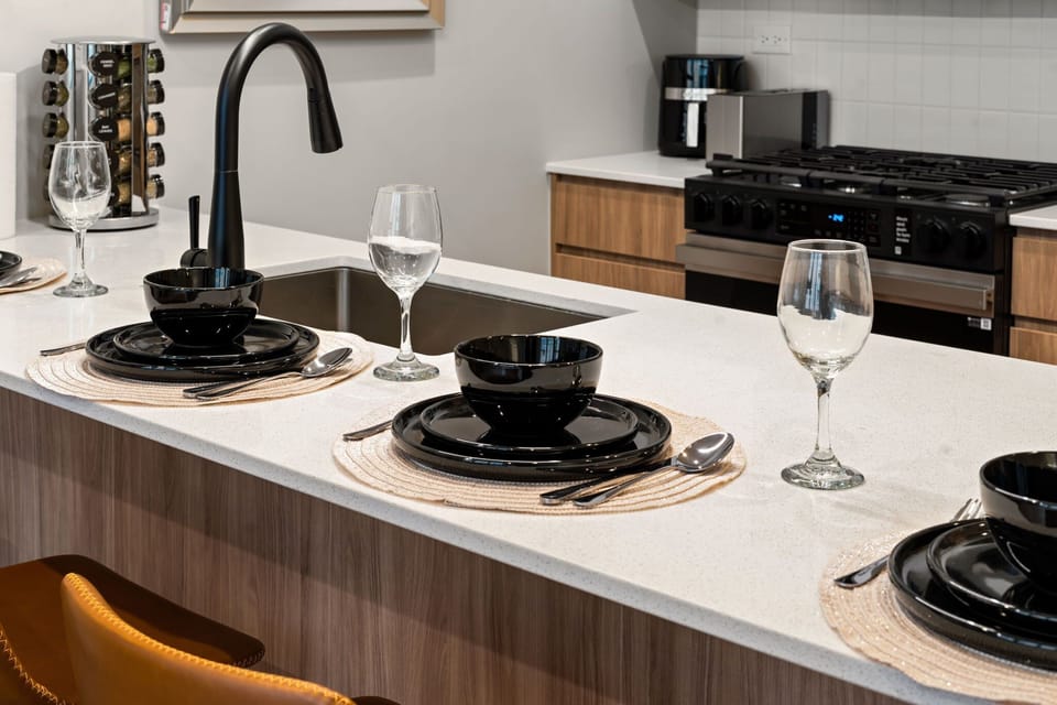 Sleek cooktop and counters offering a functional setup for everyday cooking.