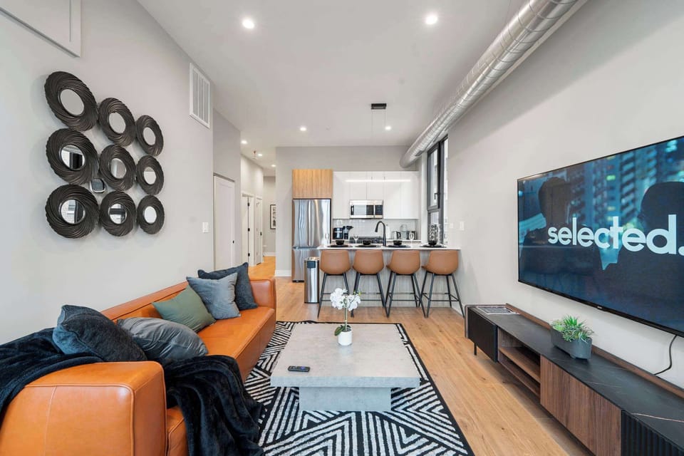 Inviting living room w/ plush seating, smart layout & a relaxed spot to recharge.