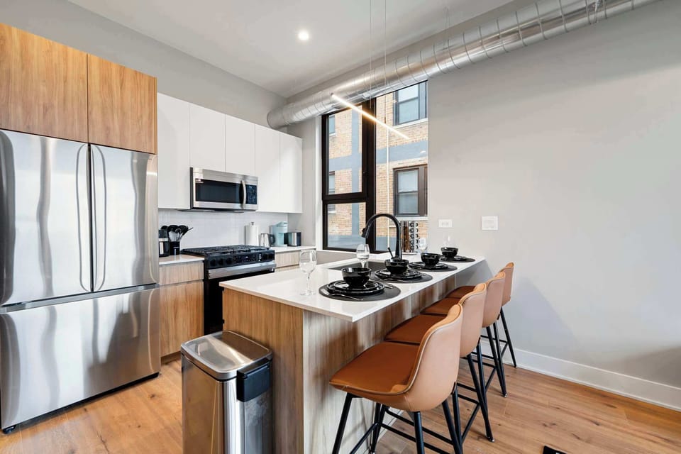 Sleek kitchen setup w/ clean lines, modern finishes & a welcoming space to cook or gather.