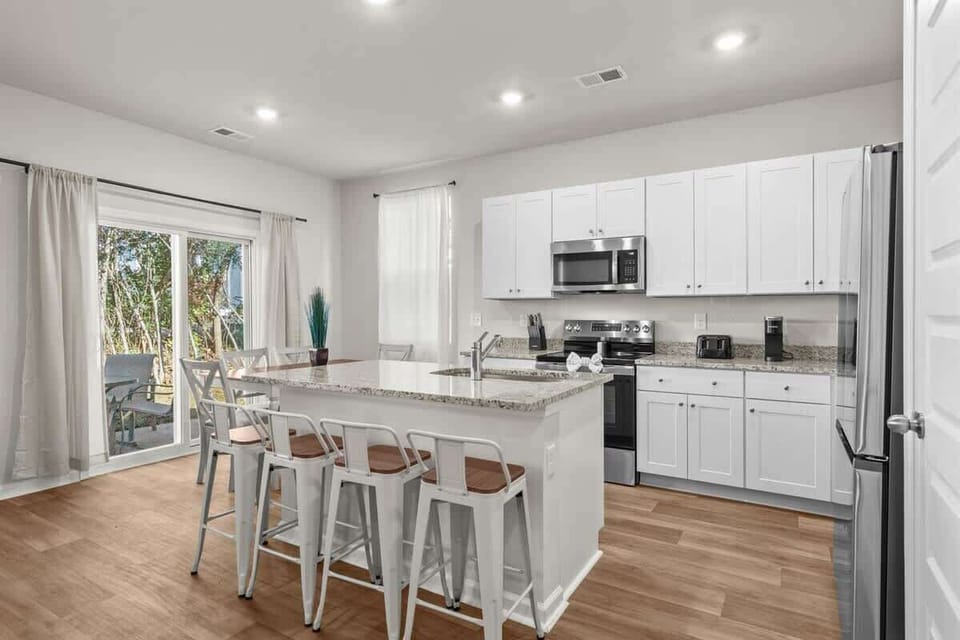 Bright, modern kitchen stocked with cooking essentials