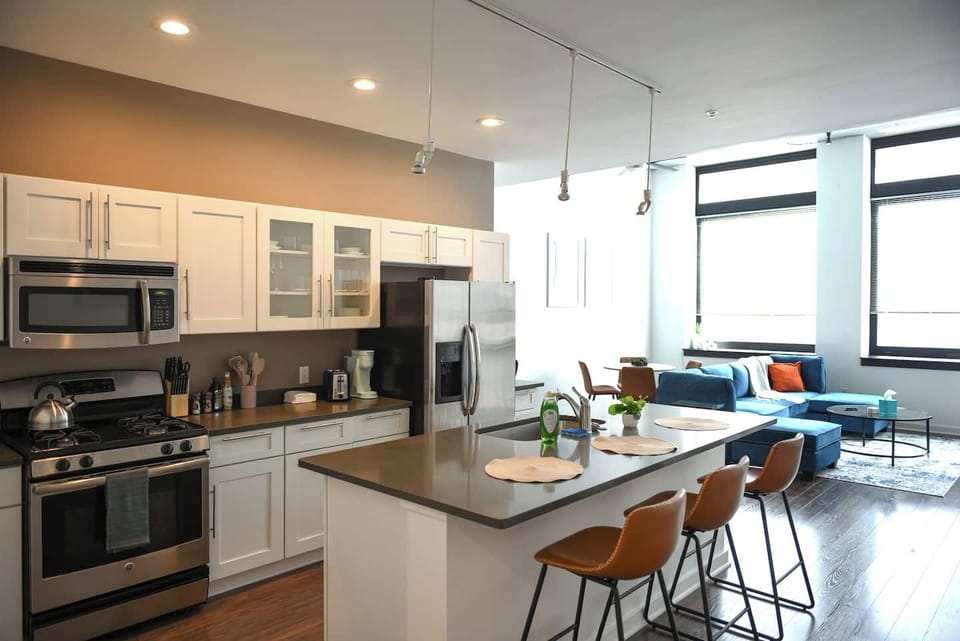 A cozy and compact kitchen featuring all the basics for preparing quick and easy meals.