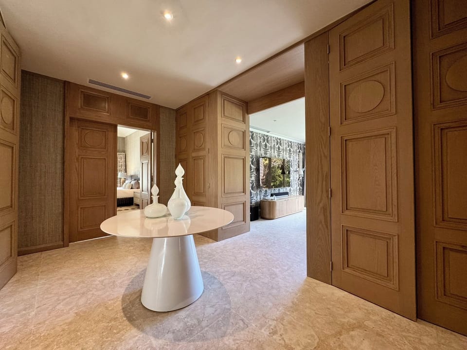 Private hall linking living areas to master/TV room.