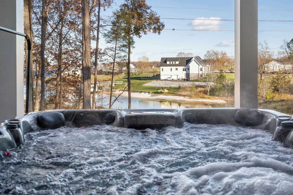 Hot Tub and Lake - Another angle of the hot tub with a clear view of the water and surrounding homes.