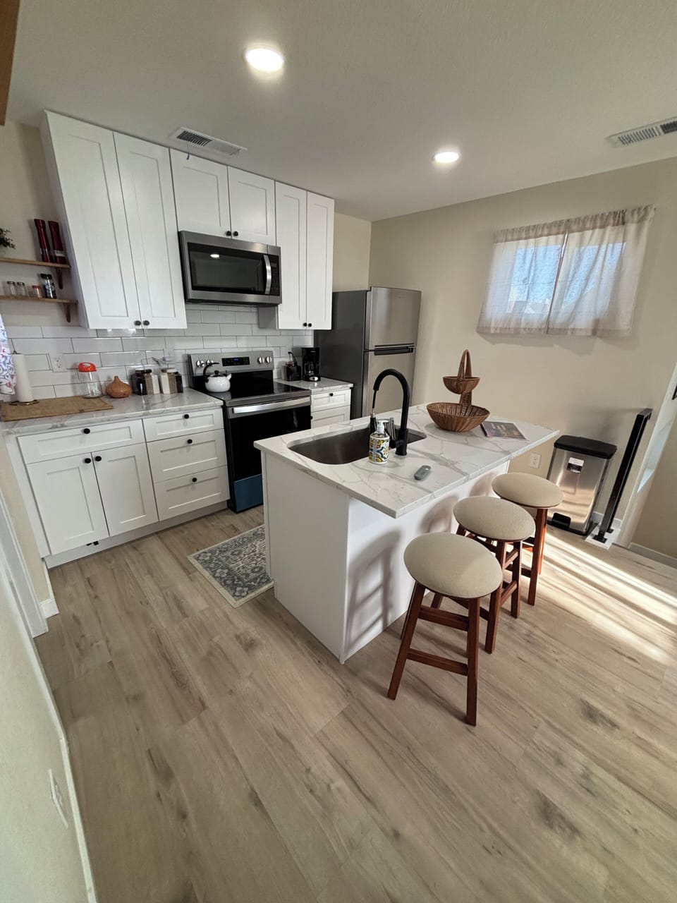 Full apartment size kitchen has a dishwasher and oven with an air fryer!