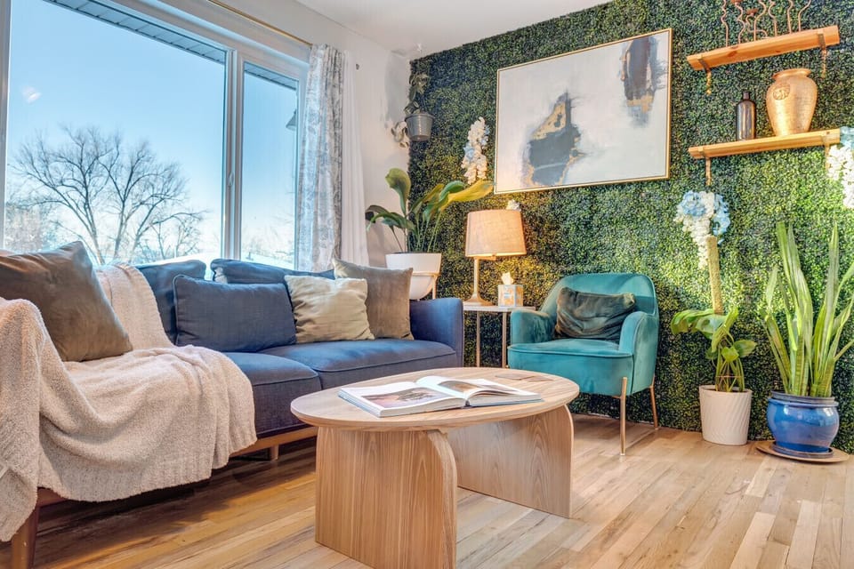 Cozy seating and floral accents create a warm, inviting space for movie nights or lazy mornings.