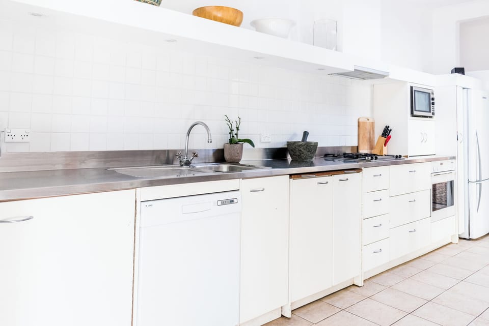 Beautiful chefs kitchen with stunning designer stainless steel benchtop