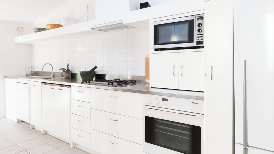 Contemporary chefs kitchen with dining are for six guests