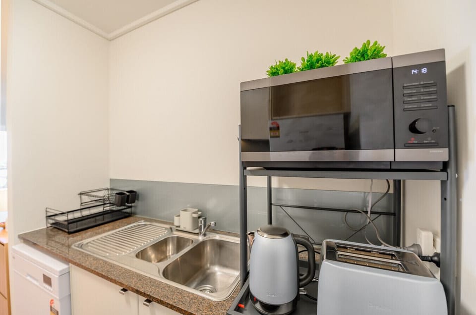 Kitchen - Microwave oven,  hot water kettle, toaster and dishwasher