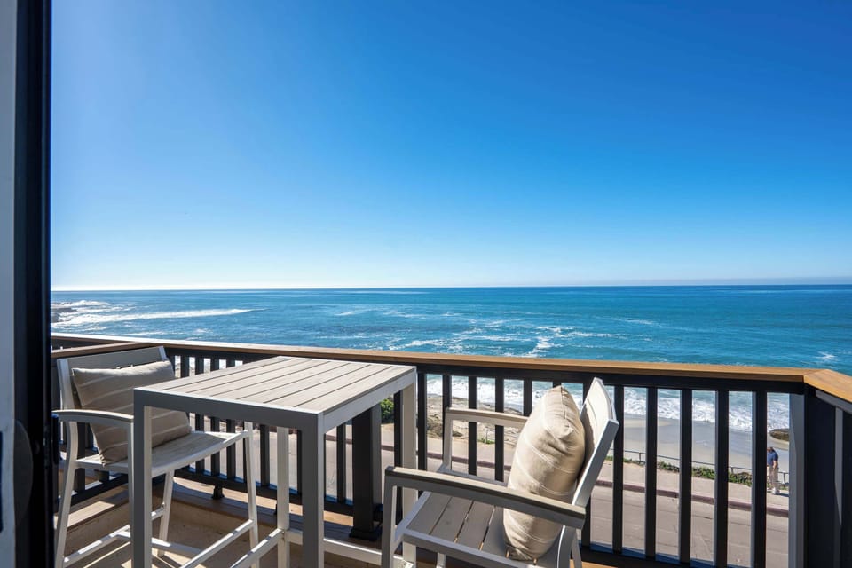 Relax on the private balcony with stunning ocean views.