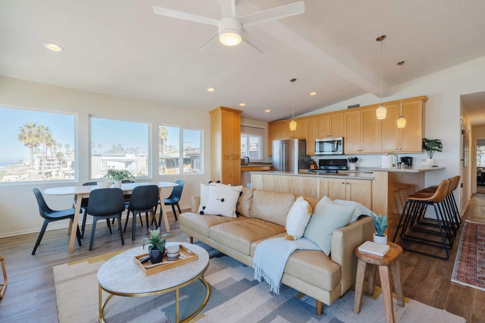 This spacious living room is perfect for family gatherings, offering plenty of seating and a welcoming ambiance.